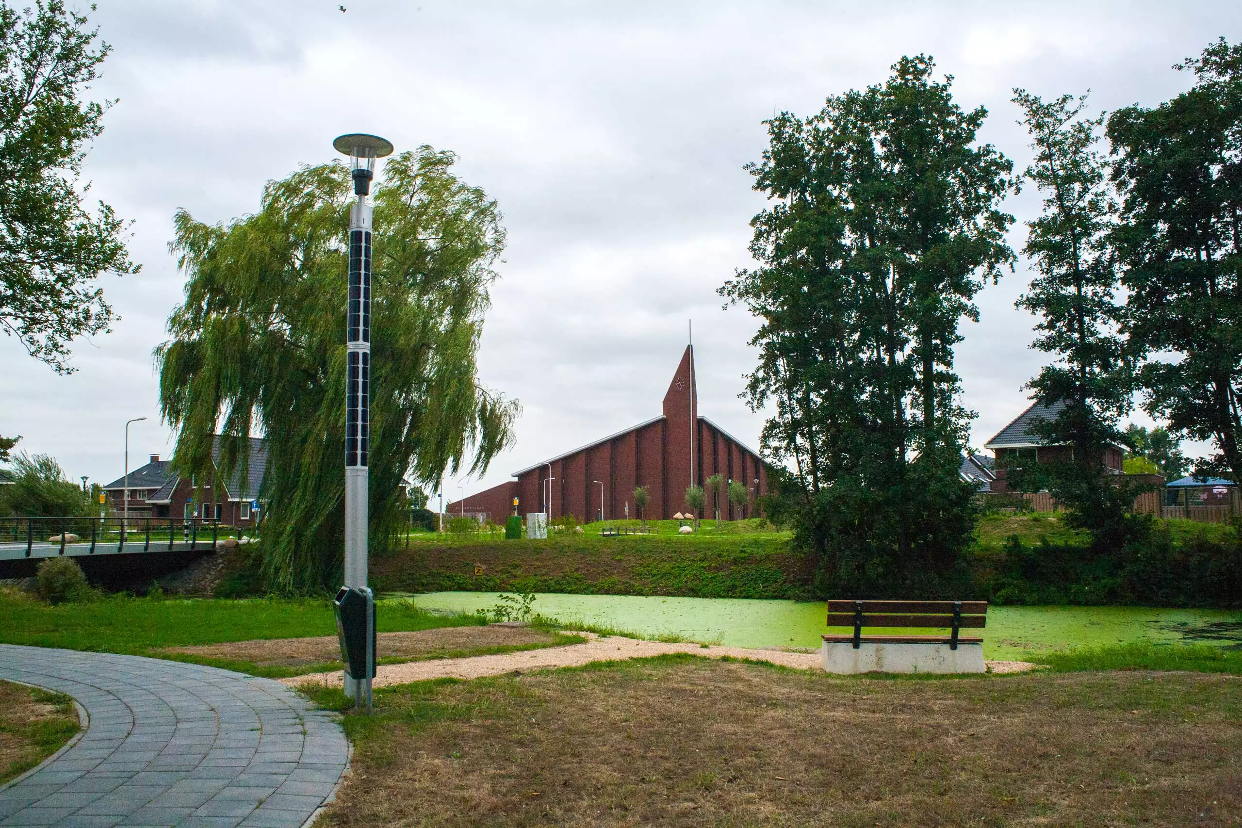 Soluxio solar landscape lighting in park with bench and a view