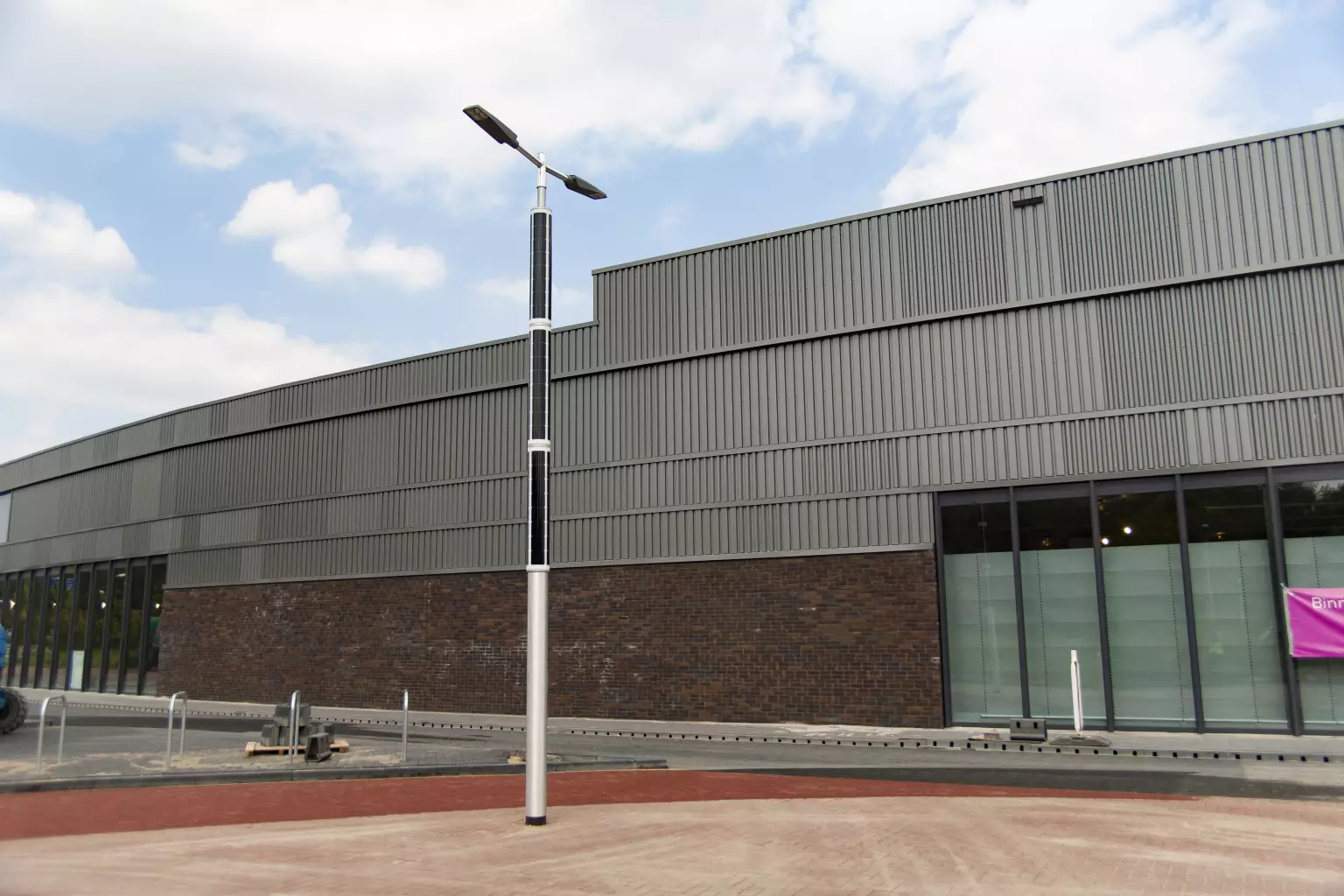 Soluxio solar lighting for public parking in front of a building